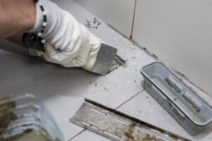 Plumber inspecting common drain problems that could damage a residential plumbing system