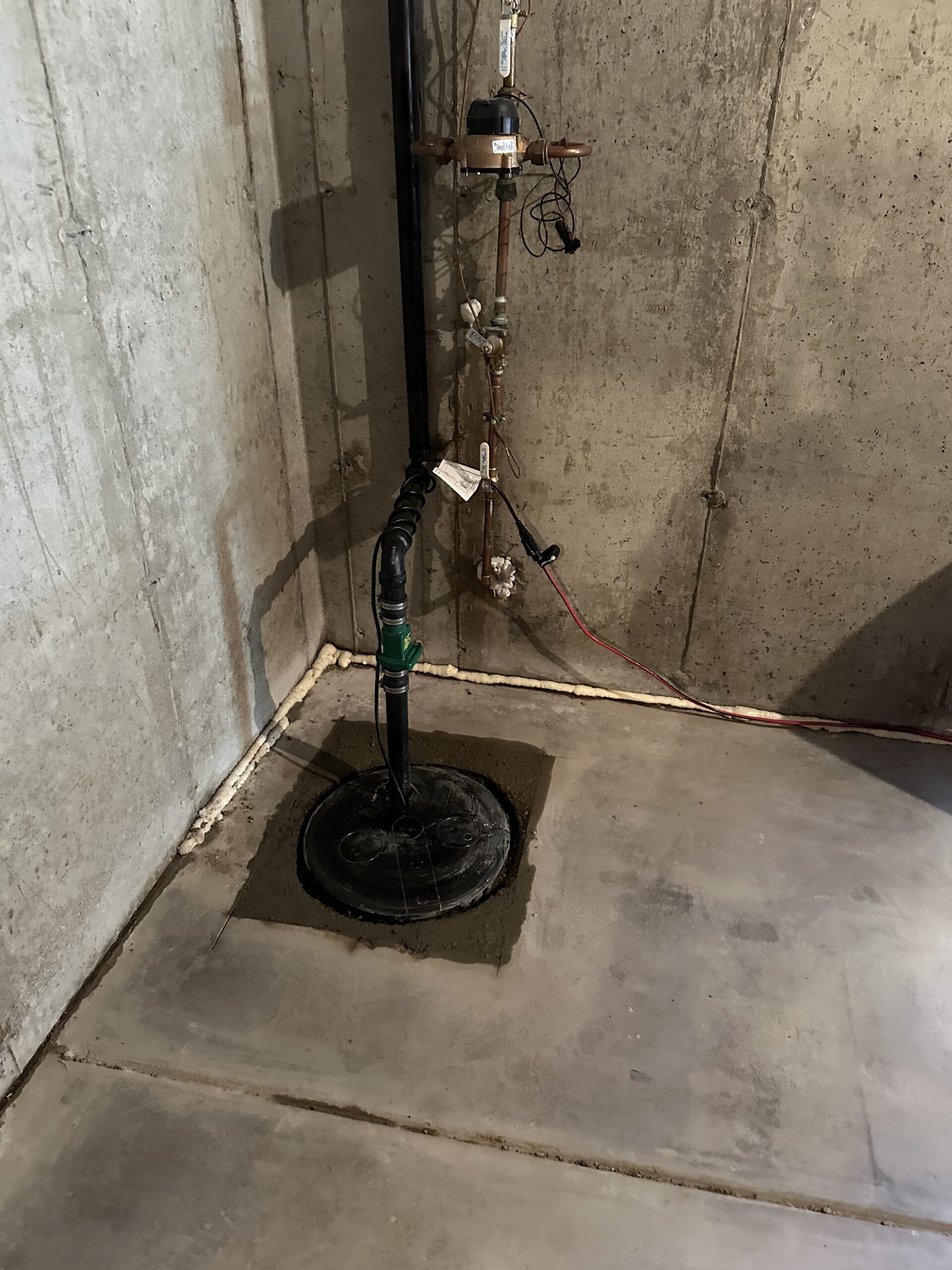Professional plumber installing water pipes in a new residential construction project